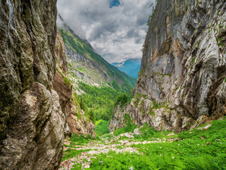 Berchtesgaden Saugasse Hike Trail down the valley with rain clouds at the background