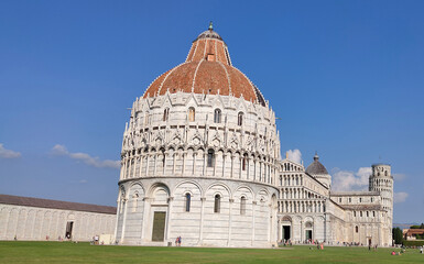 Fototapeta premium The Baptistery of Pisa Leaning Tower at the Piazza dei Miracoli or the Square of Miracles in Pisa, Italy