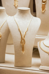 gold necklace in the jeweler's showcase