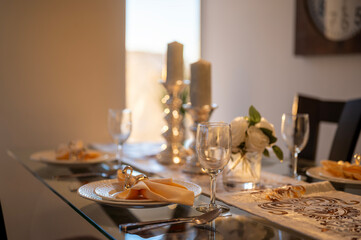 Add a touch of elegance to your space with this interior decoration set featuring a fancy plate, napkin, wine glasses, and candles. Perfect for dining room design mockups, digital artwork,
