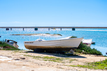 Fototapeta premium Boats in lagoons in Faro, Portugal 
