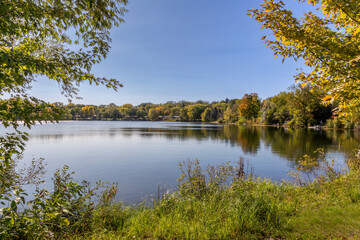 Fototapeta na wymiar Mill Pond in Jordan Minnesota with Fall Colors in background