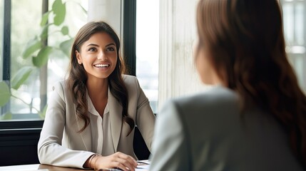 A young business woman is interviewing a job applicant. Colleagues are discussing something. Business, career and placement concept. Illustration for brochure, advertising, marketing or presentation. - obrazy, fototapety, plakaty