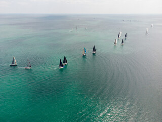 Aerial view of sailing yachts regatta race on sea
