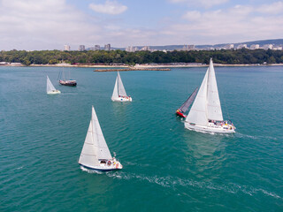 Fototapeta premium Aerial view of sailing yachts regatta race on sea