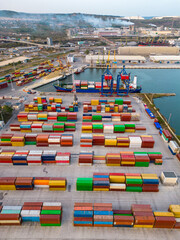 aerial view of a container ship in terminal at the port, where m - obrazy, fototapety, plakaty