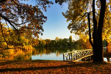 Fototapeten Lakeside with the bridge to the island in autumn © Zsuzsanna