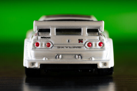 Hot Wheels model of white Nissan Skyline GT-R (R32). Rear view