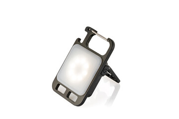 Mini LED flashlight for camping and other night outdoor activities isolated on white background. Close-up