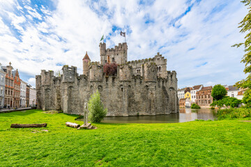 The medieval Gravensteen castle along the Leie River on a sunny summer day in the East Flanders...