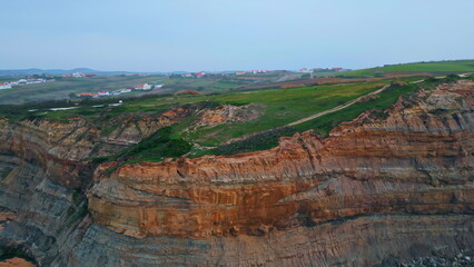 Aerial view hill landscape ocean side. Greenery slopes covered low vegetations