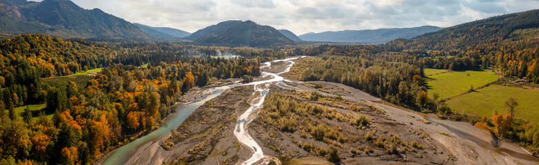Aerial panoramic view of the Nooksack River and the farmland and forest environment. The colorful fall season as seen along the Mt. Baker highway in western Washington state.