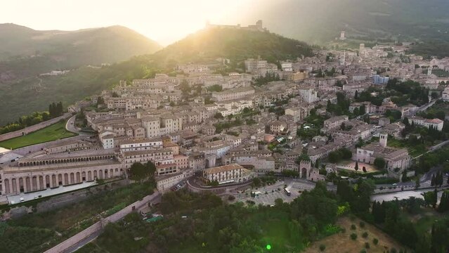 Aerial view of Assisi medieval town, Rocca Maggiore, Santa Maria sopra Minerva Church, Cathedral of San Rufino, summer morning, Umbria, Italy