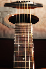 Fototapeta premium Dark detailed macro view of acoustic guitar frets and string and soundboard. Musical instruments and music theme