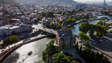 Fantastic view on Kura river , Metkhi Bridge , Metekhi Cathedral and old town of Tboilisi - drone...
