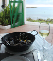 Romantic dinner for one person with mussels and white wine