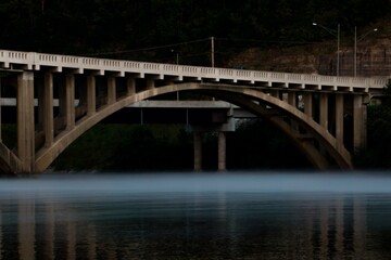 Bridge over water with fog