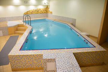 Indoor swimming pool with stainless steel ladder