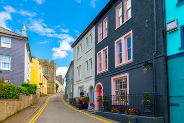 Historic buildings painted vibrant colors line the streets of the Irish seaside village of Kinsale,...