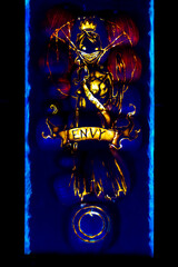 envy depiction made out of illuminated pumpkins glowing in the dark spooky