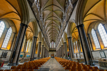 Interior view of the nave, altar, and columns in the Salisbury Cathedral, formally the Cathedral Church of the Blessed Virgin Mary, in Salisbury England.	