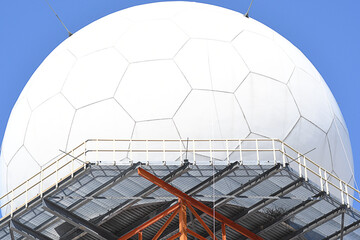 Close-up of an approach radar under a clear blue sky
