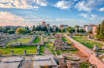 The archaeological site of the Kerameikos, the cemetery of ancient Athens, Greece. The orthodox church of Holy trinity is in the background.