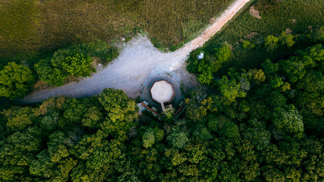 Drone view from above of the floodplain forests and bird observation tower in İğneada. Bird observation tower in the forest. Forest in lush green tones, drone view.