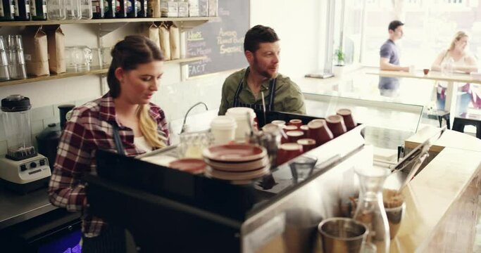 Coffee shop, purchase and service for customer by a waitress with espresso for consumer in a cafe or small business. Barista, restaurant and employee with latte, cappuccino or drink in store