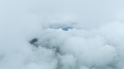 Aerial photographs were taken with a latest generation drone above dense gray clouds. Sky above the...