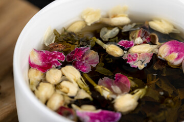 green tea with rose and jasmine flowers