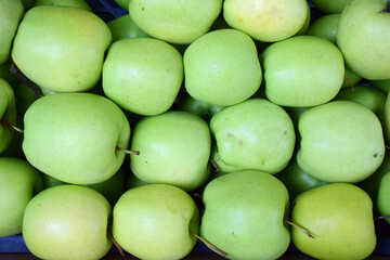 Close up fresh green apples at the market