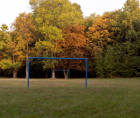 Obraz na płótnie Canvas blue football gates in the park in autumn