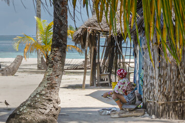 Old caribbean native sitting  on the shadow
