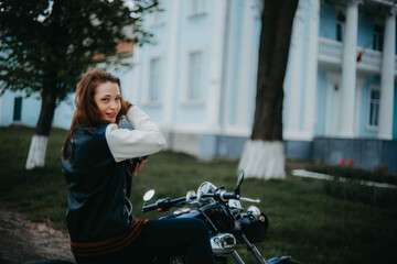 Plakat long-haired woman motorcyclist on a classic motorcycle.
