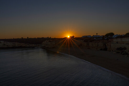 Sunset on the beach of Senhora da Rocha beach in Porches, Lagoa, Algarve Portugal.