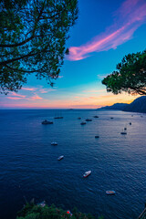 Sunset over the coast in Positano, Amalfi Coast, Campagna Italy - obrazy, fototapety, plakaty