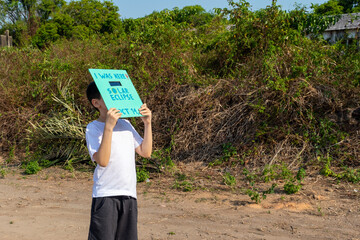 Young boy, age 10, watching the annular solar eclipse across the Americas on october 14, 2023, with...
