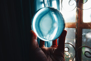 lens ball photography : Peaceful relaxing blue magic sphere, Fortune teller, mind power, peaceful energy concept,