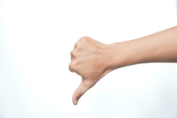 Arm and hand of asian young man over white isolated background doing thumbs down rejection gesture,...