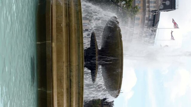 Vertical clip of water fountain in Trafalgar square in London, England.