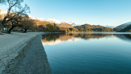 Dawn scenery at Glendhu bay campground  looking across Lake Wanaka towards the snow capped mountains in Mt Aspiring National Park
