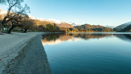Papier Peint photo autocollant Plage de Camps Bay, Le Cap, Afrique du Sud Dawn scenery at Glendhu bay campground  looking across Lake Wanaka towards the snow capped mountains in Mt Aspiring National Park