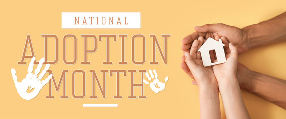 Hands of family with small house on color background