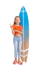 Little girl with surfboard showing victory gesture on white background