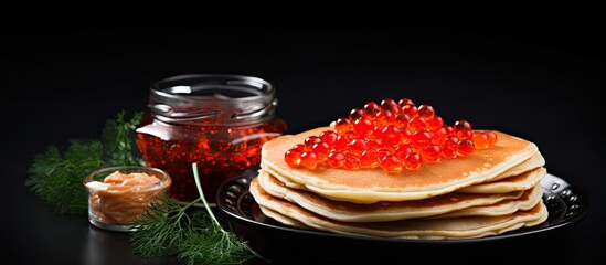 Prepared meals pancakes and red caviar With copyspace for text