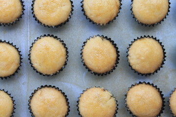 Rows of Indonesian cakes called nastar cooked in a baking pan on the table ready to be served