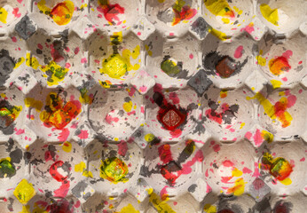 Fototapeta na wymiar Watercolor splashes, overlapping and messy, on the egg panels. red yellow and gray