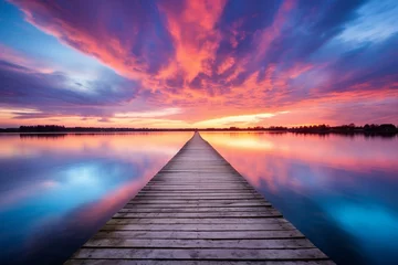  beautiful evening sky casting vibrant colors reflecting on a wooden jetty extending over a calm body of water. Generative AI © Lavinia