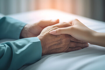 closeup hand of geriatric with nursing caregiver.